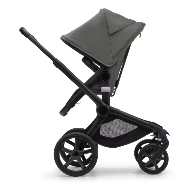 Side view of the Bugaboo Fox 5 seat stroller with black chassis, grey melange fabrics and forest green sun canopy. - Main Image Slide 3 of 12