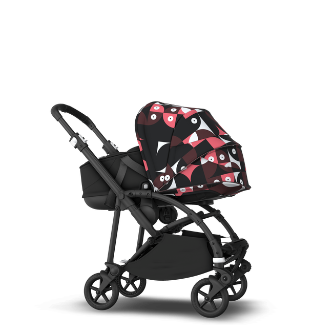 Bugaboo Bee 6 bassinet and seat stroller black base, black fabrics, animal explorer pink/ red sun canopy