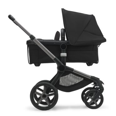 Side view of the Bugaboo Fox 5 bassinet stroller with graphite chassis, midnight black fabrics and midnight black sun canopy. - view 2