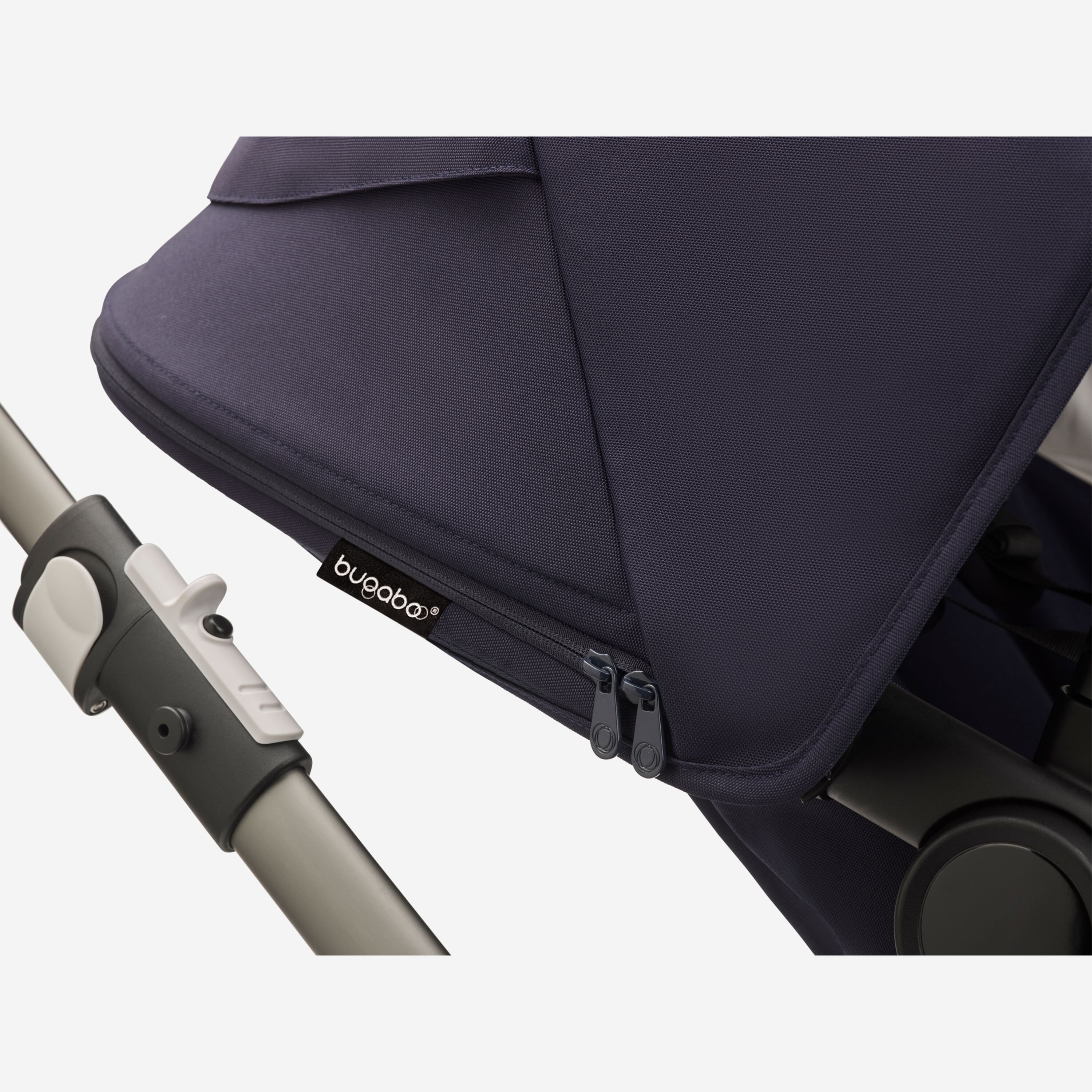 Close up of a Fox 3 dark navy sun canopy with the Bugaboo logo tag. - Main Modal Image Slide 7 of 13