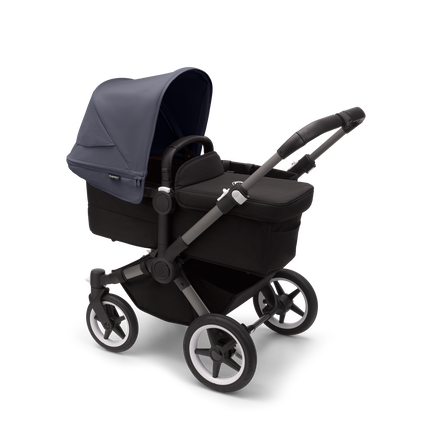 Bugaboo Donkey 5 Mono bassinet stroller with graphite chassis, midnight black fabrics and stormy blue sun canopy.