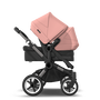 Bugaboo Donkey 5 Duo bassinet and seat stroller graphite base, midnight black fabrics, morning pink sun canopy - Thumbnail Slide 4 of 12