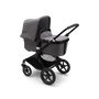 Bugaboo Fox 3 bassinet stroller with black frame, grey fabrics, and grey sun canopy.