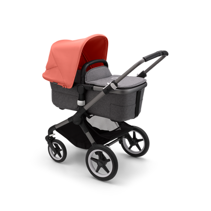 Bugaboo Fox 3 bassinet stroller with graphite frame, grey fabrics, and red sun canopy.