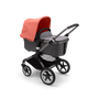 Bugaboo Fox 3 bassinet stroller with graphite frame, grey fabrics, and red sun canopy. - Thumbnail Modal Image Slide 2 of 7