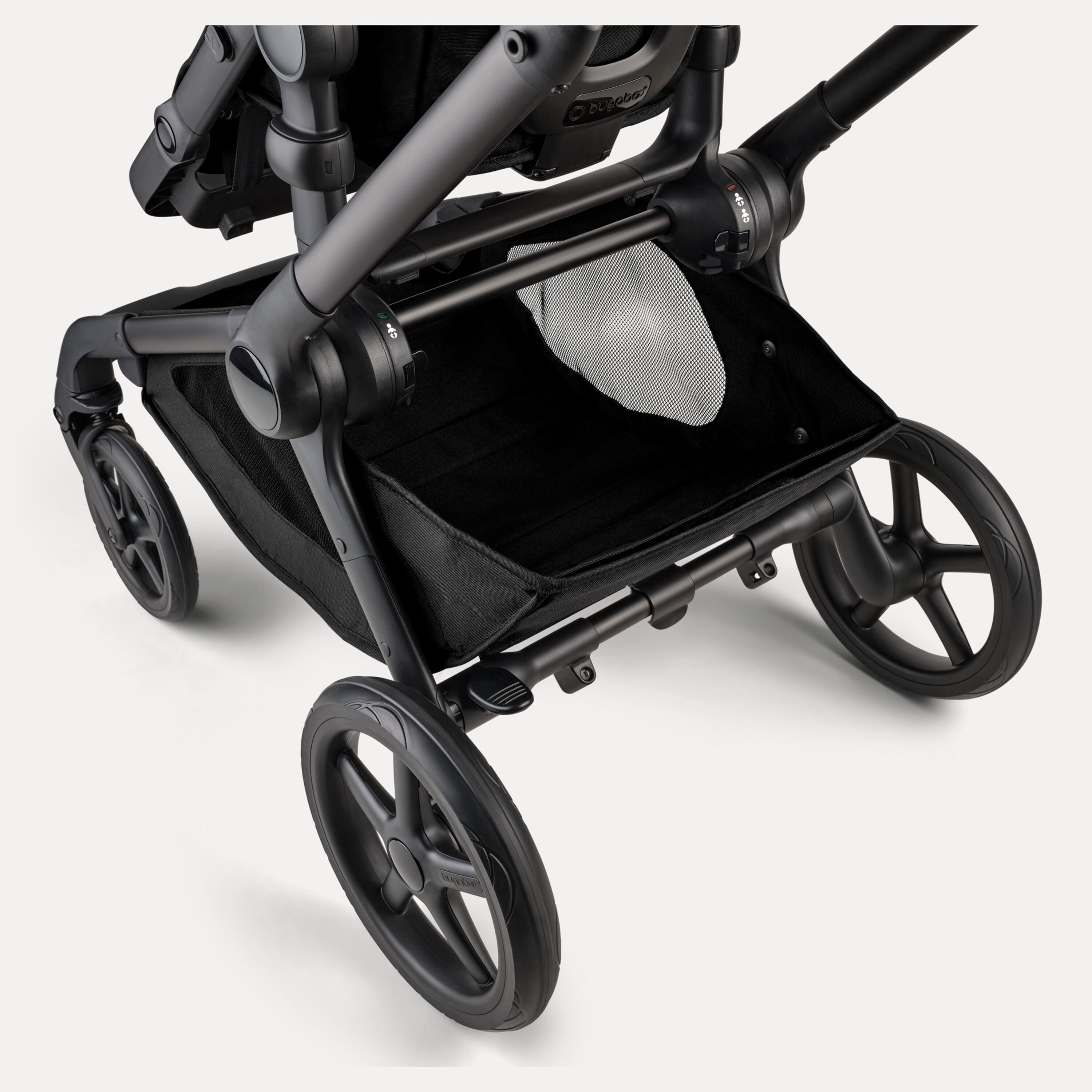 A close-up of the extra-large underseat basket of the Bugaboo Kangaroo 2-in-1 stroller. - Main Modal Image Slide 8 of 18
