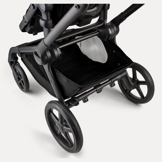 A close-up of the extra-large underseat basket of the Bugaboo Kangaroo 2-in-1 stroller. - Main Image Slide 8 of 18