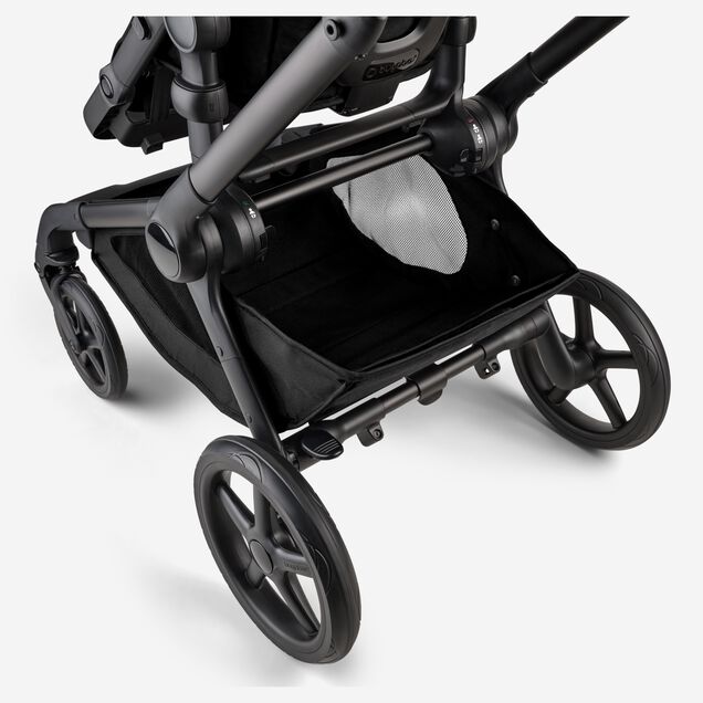 A close-up of the extra-large underseat basket of the Bugaboo Kangaroo 2-in-1 stroller. - Main Image Slide 8 of 18