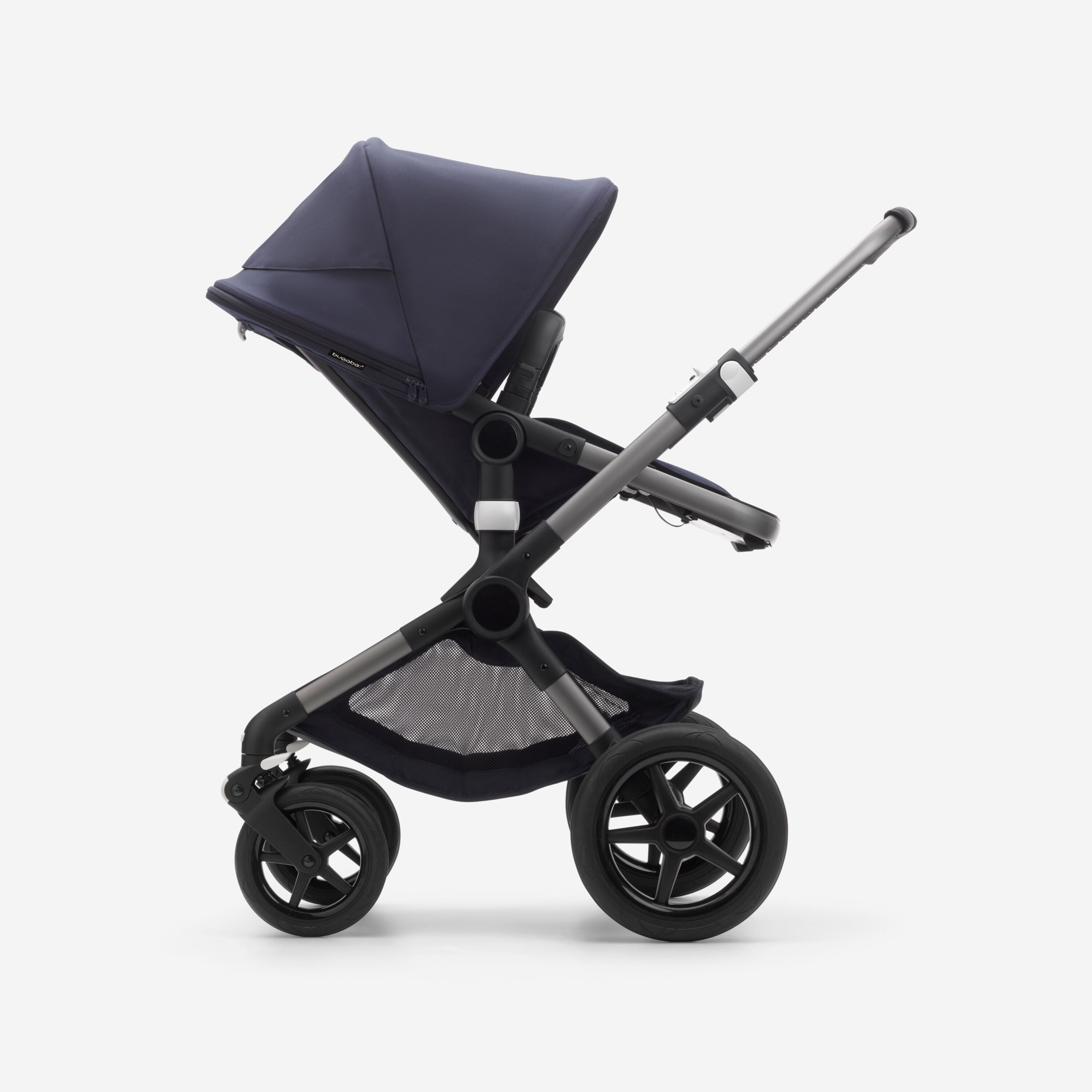Side view of a Fox 3 seat pushchair with graphite frame, dark navy fabrics, and dark navy sun canopy. - Main Modal Image Slide 12 of 13