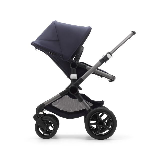 Side view of a Fox 3 seat pushchair with graphite frame, dark navy fabrics, and dark navy sun canopy. - Main Image Slide 12 of 13