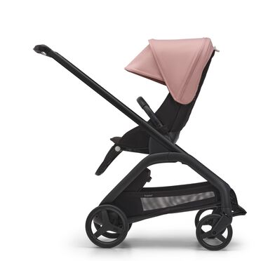Side view of the Bugaboo Dragonfly seat stroller with black chassis, midnight black fabrics and morning pink sun canopy. - view 2