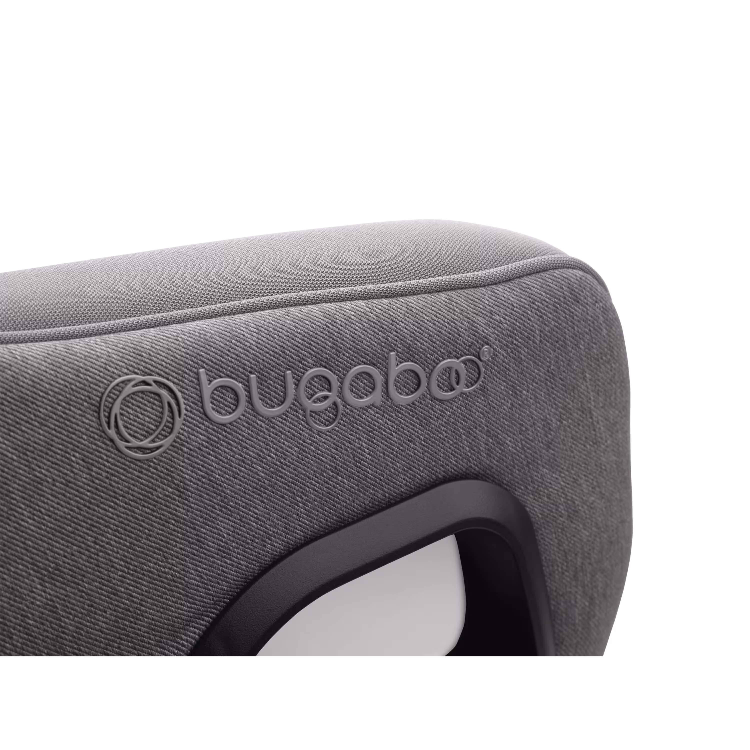 Close up of the embossed Bugaboo logo on the Bugaboo Owl by Nuna car seat in grey fabrics. - Main Modal Image Slide 10 of 11
