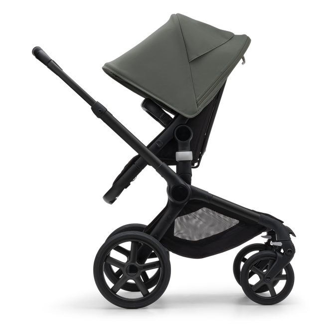 Side view of the Bugaboo Fox 5 seat stroller with black chassis, midnight black fabrics and forest green sun canopy.