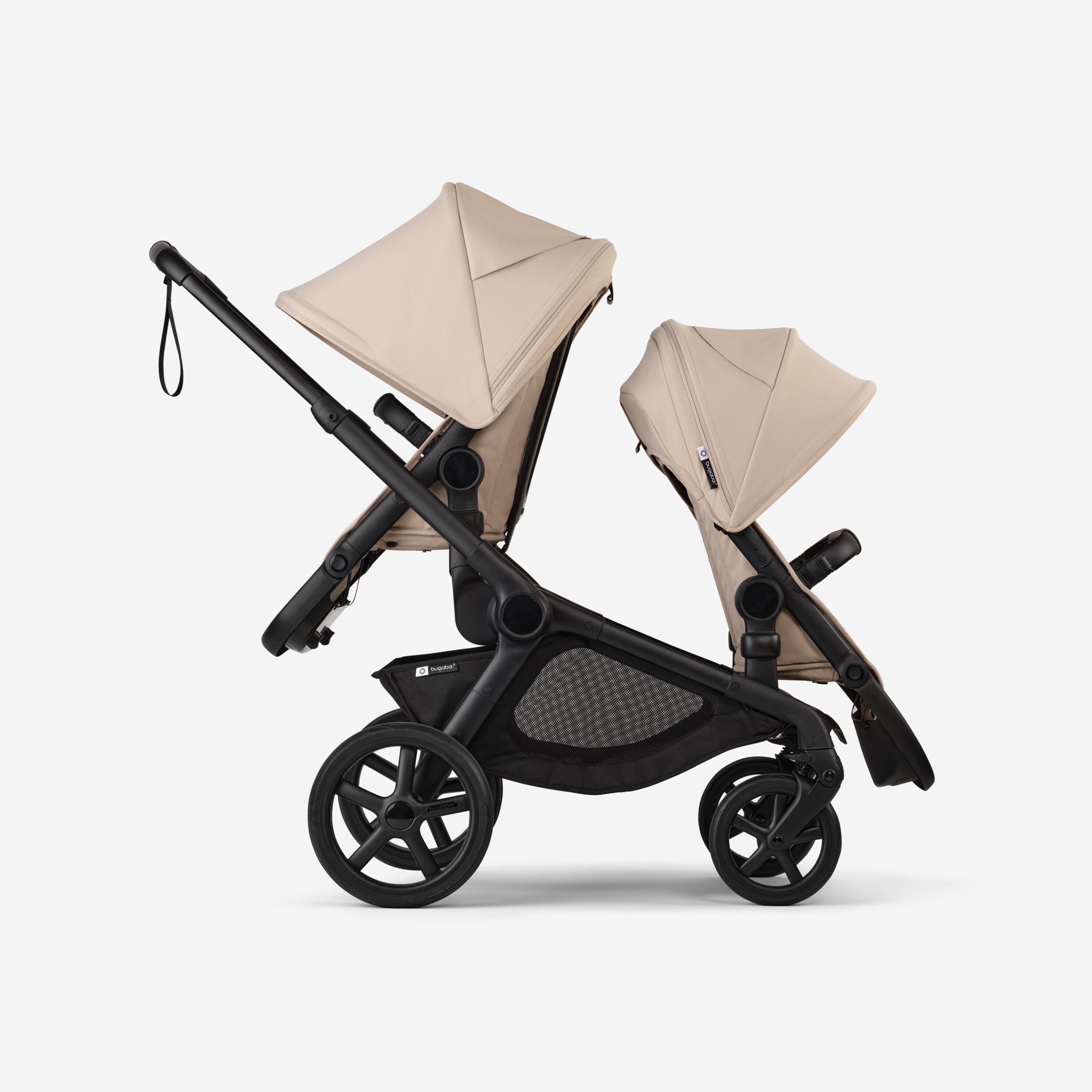 Side view of Bugaboo Kangaroo 2-in-1 tandem stroller with two seats, one facing parent and the other facing the world, with Desert Taupe fabrics and Desert Taupe sun canopies. - Main Modal Image Slide 4 of 18