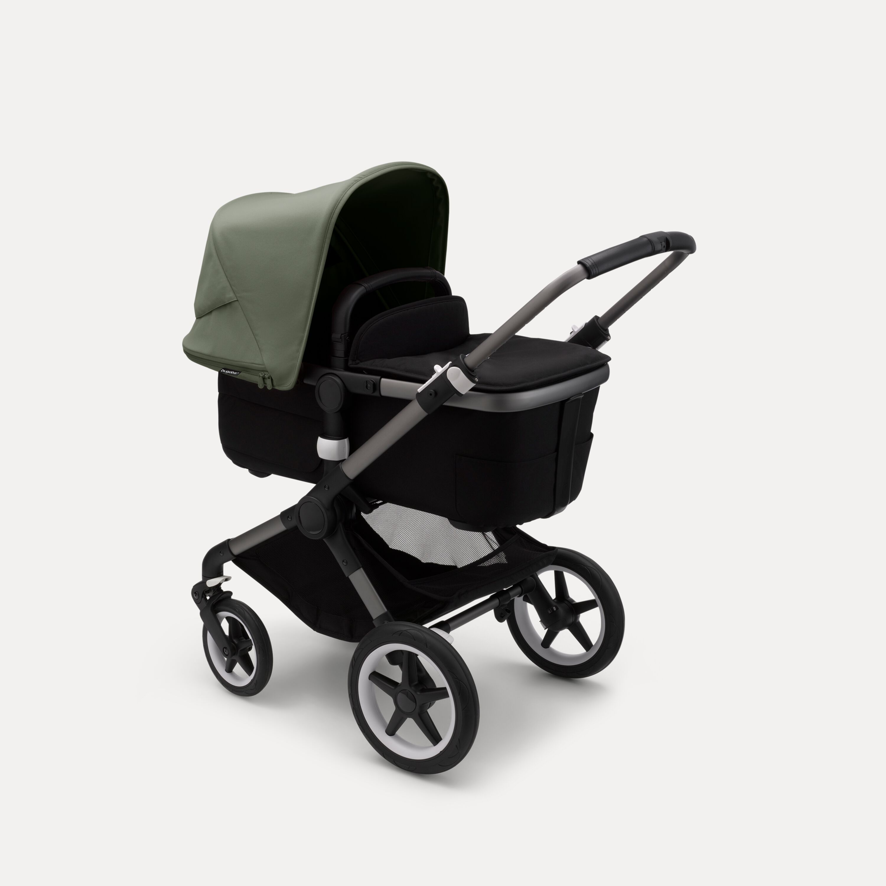 Bugaboo Fox 3 bassinet stroller with graphite frame, black fabrics, and forest green sun canopy. - Main Modal Image Slide 2 of 7