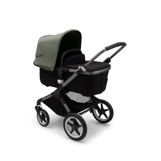 Bugaboo Fox 3 bassinet stroller with graphite frame, black fabrics, and forest green sun canopy. - Main Image Slide 2 of 7