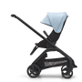 Side view of the Bugaboo Dragonfly seat stroller with black chassis, midnight black fabrics and skyline blue sun canopy.