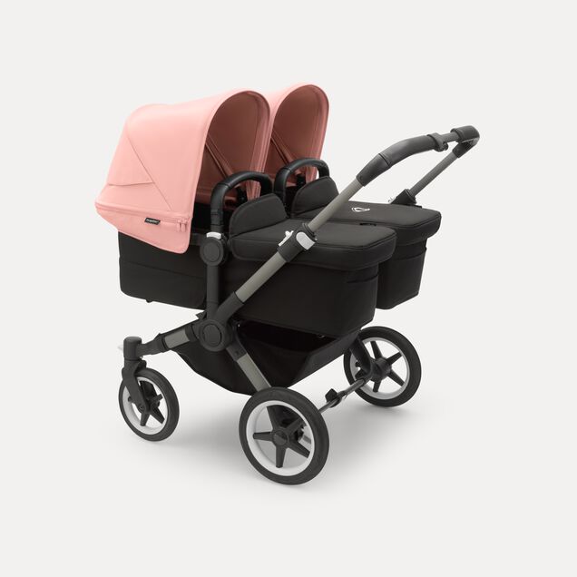 Bugaboo Donkey 5 twin stroller graphite base, midnight black fabrics, morning pink sun canopy - Main Image Slide 1 of 10
