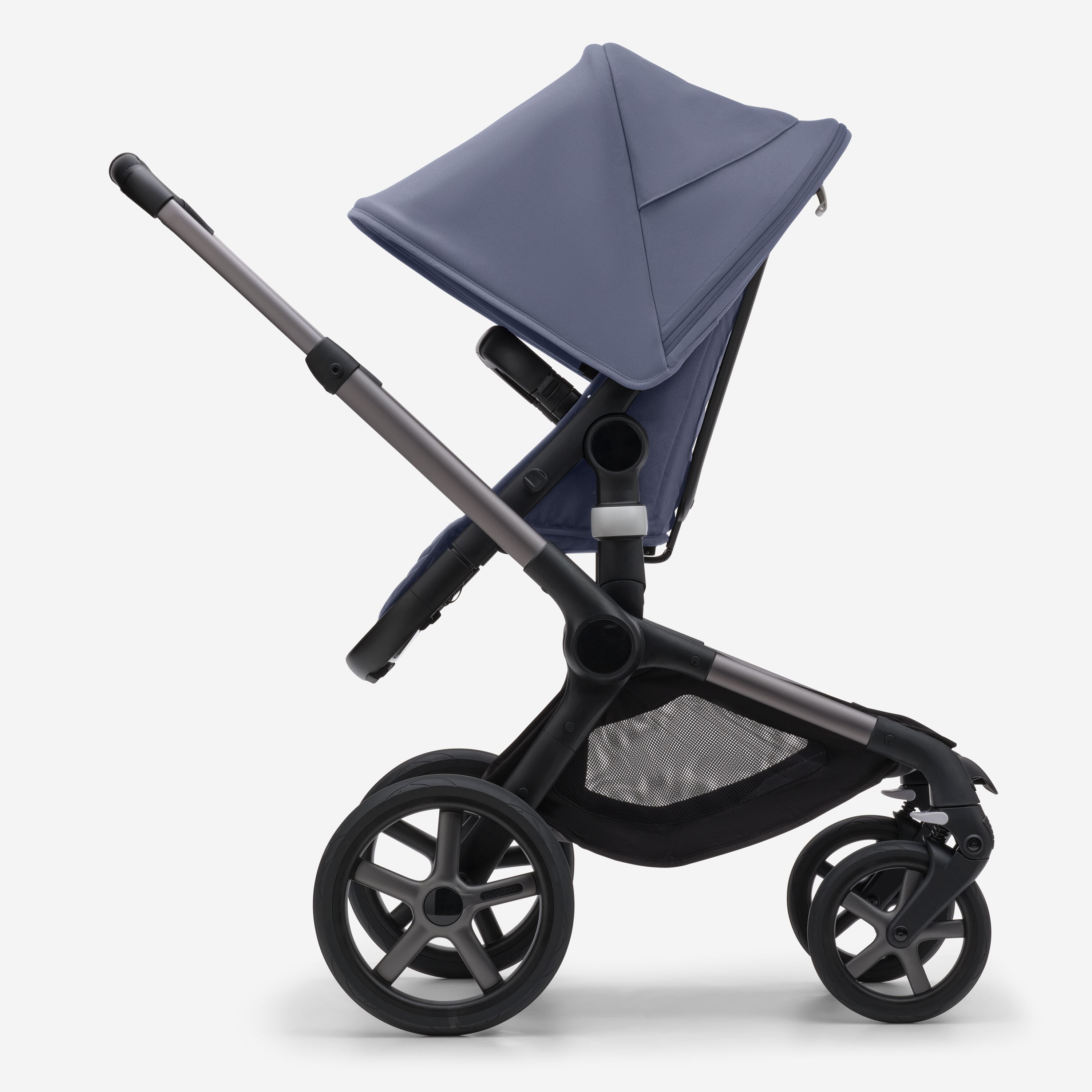Side view of the Bugaboo Fox 5 seat stroller with graphite chassis, midnight black fabrics and stormy blue sun canopy. - Main Modal Image Slide 3 of 12