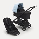 Poussette siège et nacelle Bugaboo Dragonfly avec châssis noir, habillages nuit noire et capote bleu horizon.