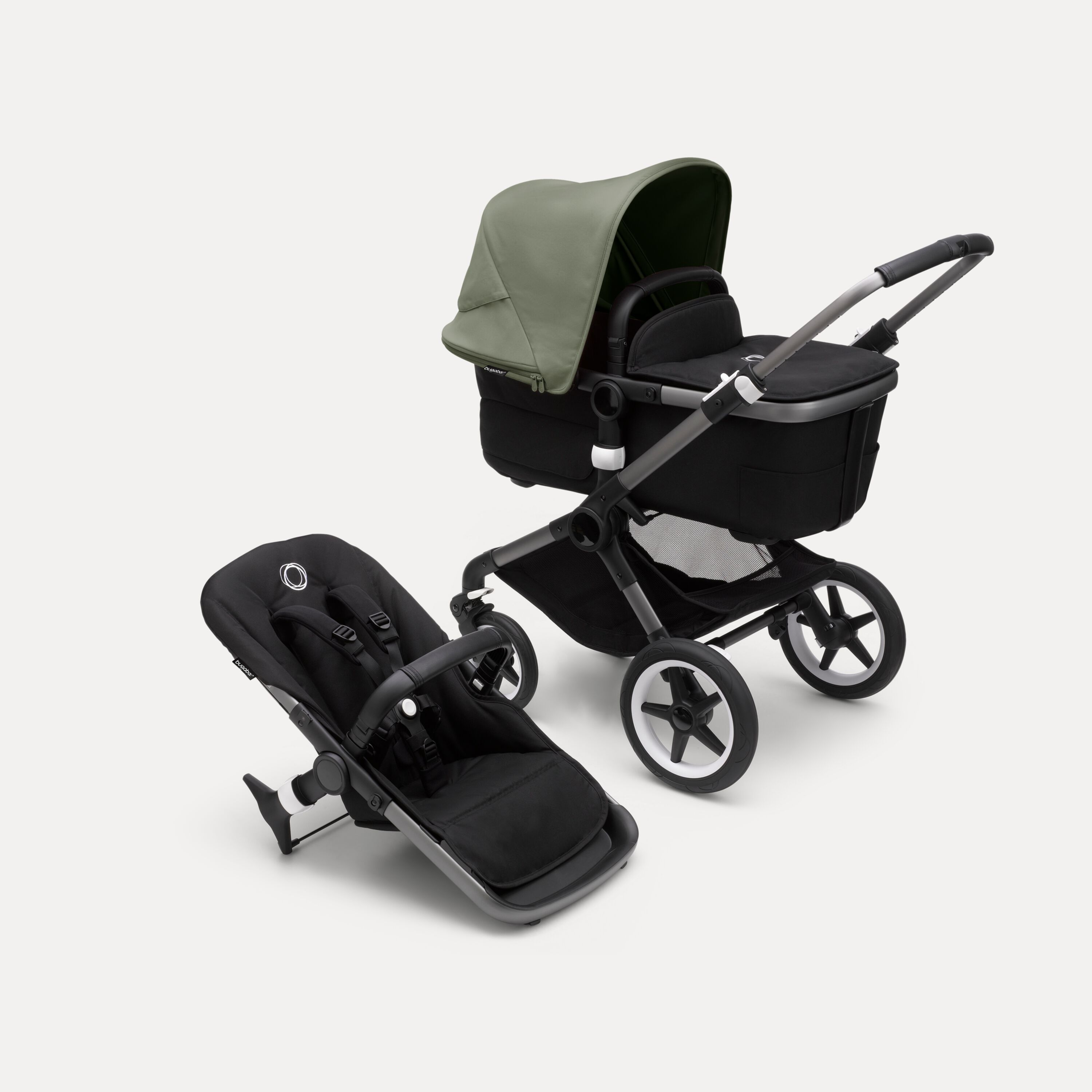 Bugaboo Fox 3 bassinet and seat stroller with graphite frame, black fabrics, and forest green sun canopy. - Main Modal Image Slide 1 of 7