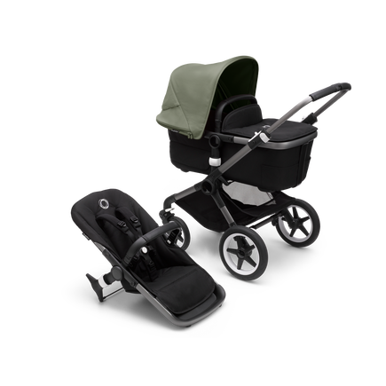 Bugaboo Fox 3 bassinet and seat stroller with graphite frame, black fabrics, and forest green sun canopy.