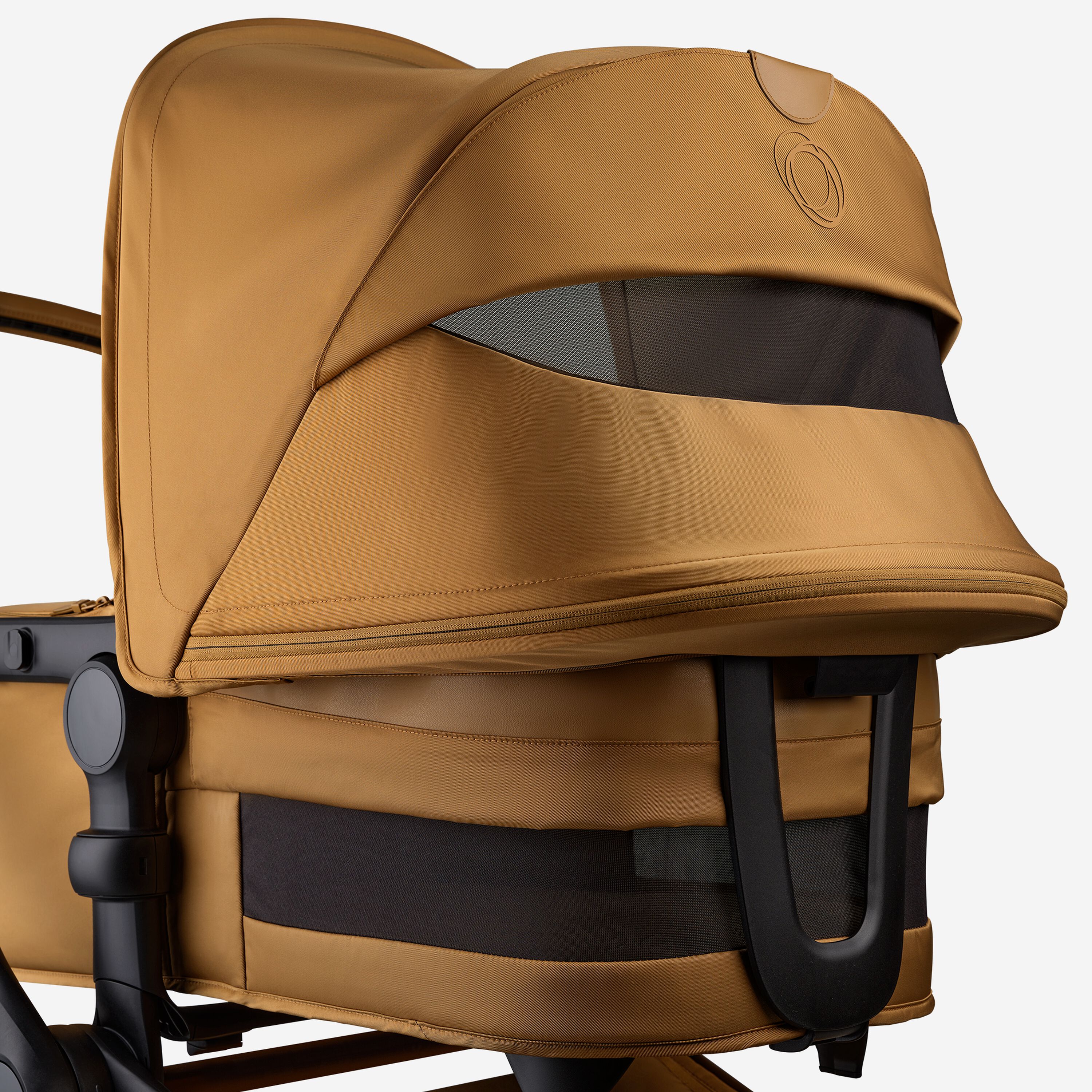 A close up of the sun canopy and the bassinet of the Bugaboo Fox 5 Noir Limited Edition Amber Glow. The canopy and bassinet's breezy panels are visible. - Main Modal Image Slide 7 of 15