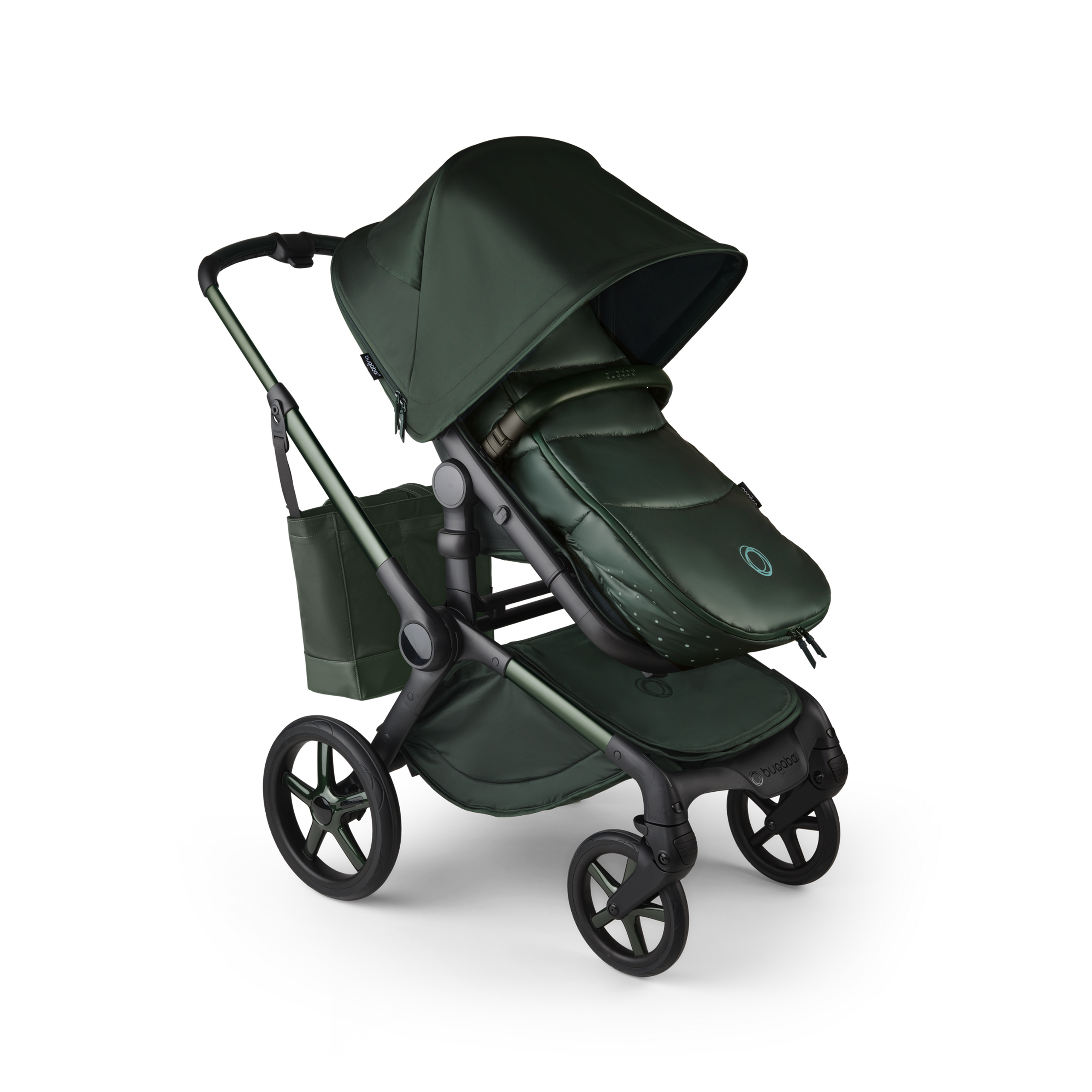 A Bugaboo Fox 5 Noir Limited Edition stroller with a footmuff and changing bag, all in the Midnight Green colorway. - Thumbnail Slide 15 of 15
