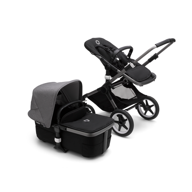 Bugaboo Fox 3 bassinet and seat stroller with graphite frame, black fabrics, and grey sun canopy.