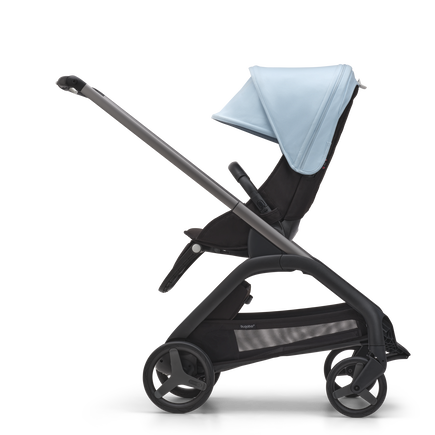 Side view of the Bugaboo Dragonfly seat stroller with graphite chassis, midnight black fabrics and skyline blue sun canopy.