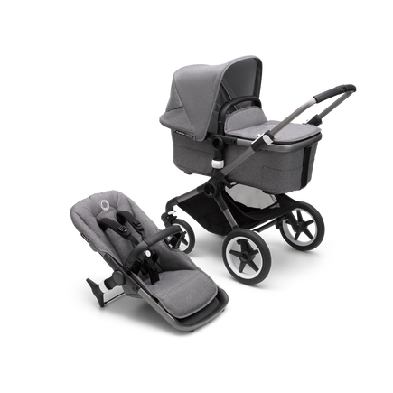 Bugaboo Fox 3 carrycot and seat pushchair with graphite frame, grey fabrics, and grey sun canopy.