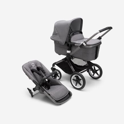 Bugaboo Fox 3 bassinet and seat stroller with graphite frame, grey fabrics, and grey sun canopy.