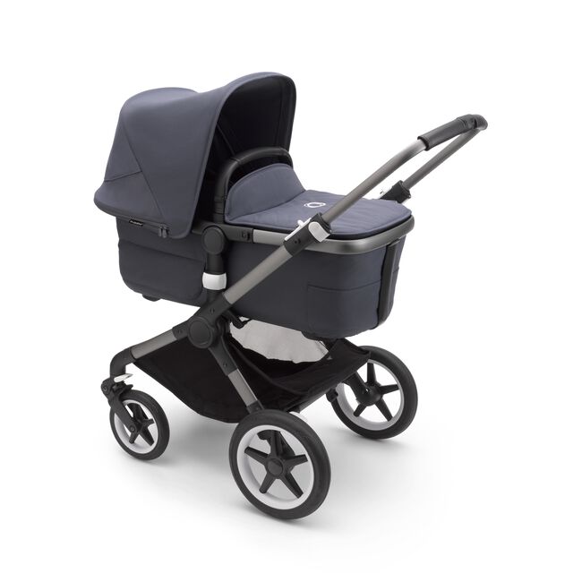Bugaboo Fox 3 carrycot pushchair with graphite frame, stormy blue fabrics, and stormy blue sun canopy. - Main Image Slide 2 of 9