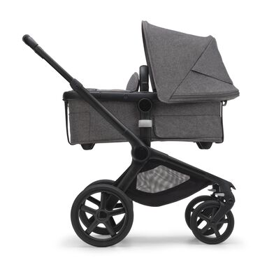 Side view of the Bugaboo Fox 5 carrycot pushchair with black chassis, grey melange fabrics and grey melange sun canopy. - view 2