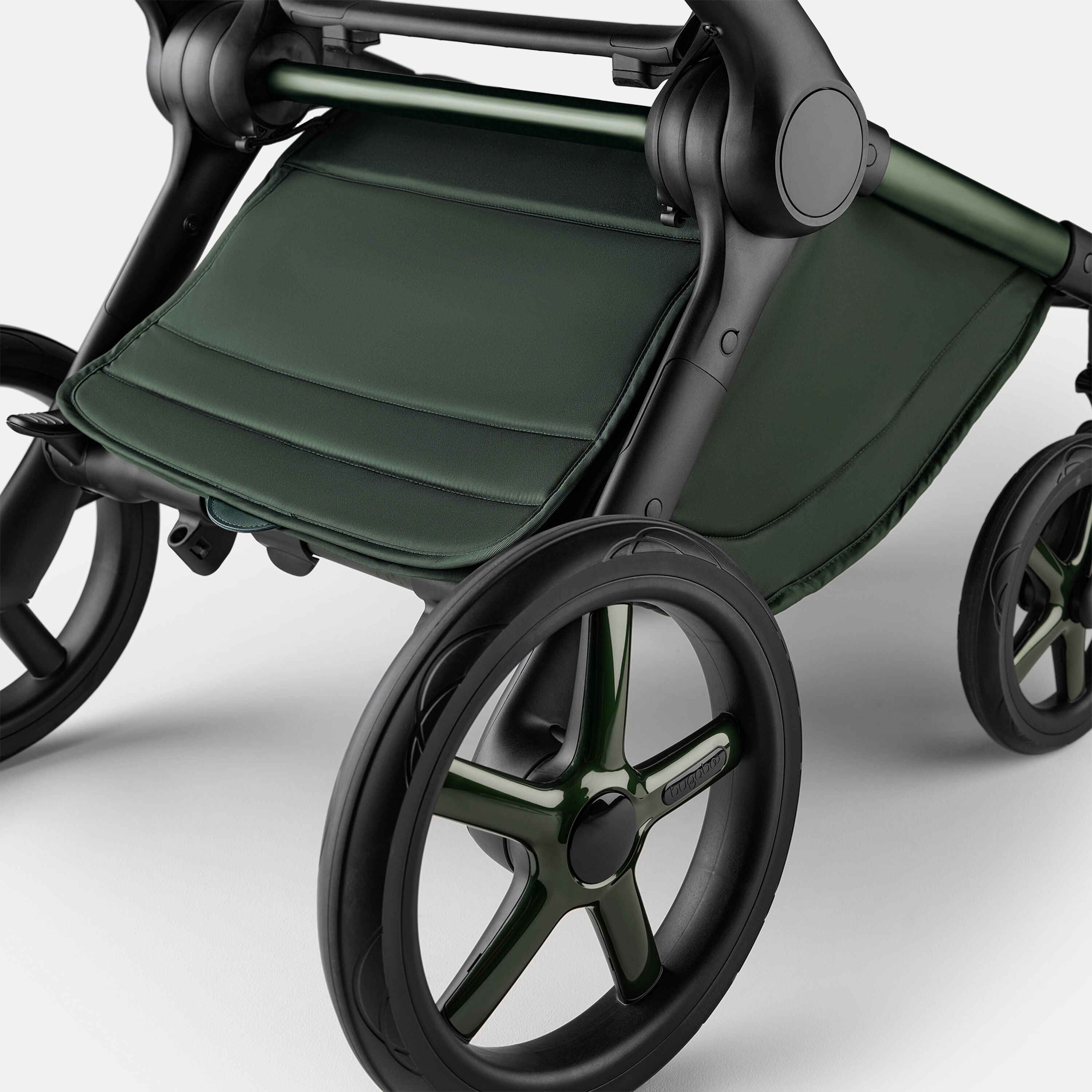 A close up of the underseat basket of the Bugaboo Fox 5 Noir Limited Edition stroller in Midnight Green. - Main Modal Image Slide 6 of 15