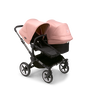 Bugaboo Donkey 5 Duo seat and bassinet stroller with graphite chassis, midnight black fabrics and morning pink sun canopy. - Thumbnail Slide 1 of 12
