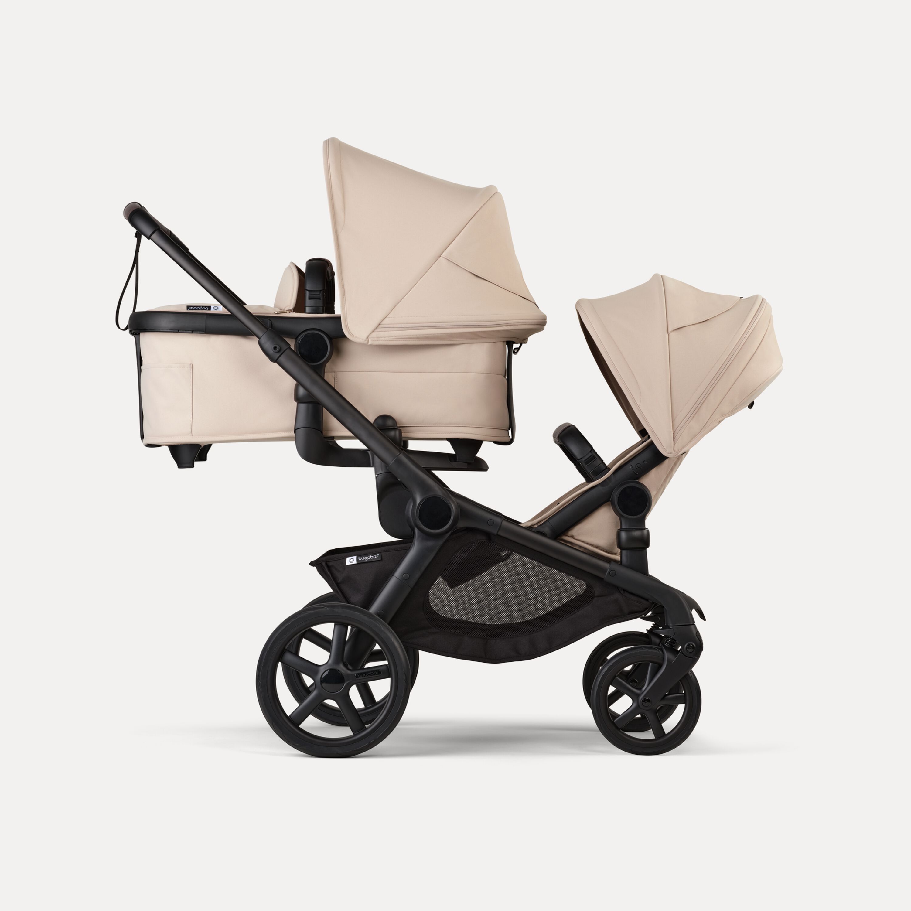 Bugaboo Kangaroo 2-in-1 tandem stroller with one bassinet above and one seat below, with Desert Taupe fabrics and Desert Taupe sun canopies. - Main Modal Image Slide 2 of 18