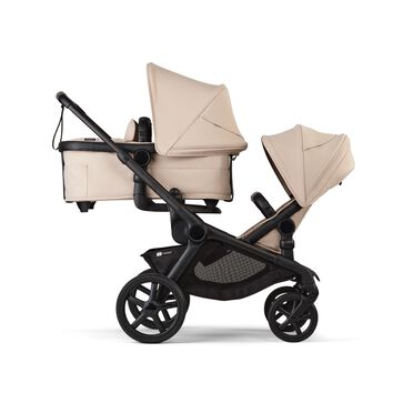 Bugaboo Kangaroo 2-in-1 tandem stroller with one bassinet above and one seat below, with Desert Taupe fabrics and Desert Taupe sun canopies. - view 2
