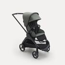Bugaboo Dragonfly seat stroller with black chassis, forest green fabrics and forest green sun canopy.