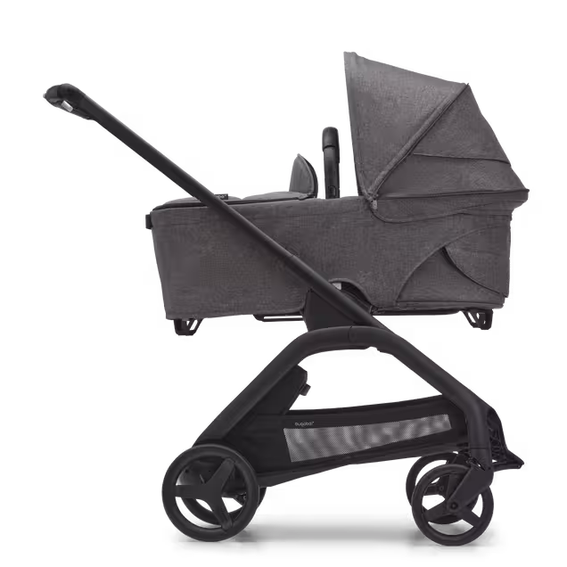 Side view of the Bugaboo Dragonfly bassinet stroller with black chassis, grey melange fabrics and grey melange sun canopy. - Main Image Slide 3 of 16