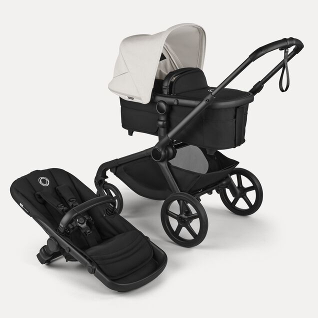 Bugaboo Kangaroo 2-in-1 stroller with one bassinet, Midnight Black fabrics, and Misty White sun canopy. A detached seat in Midnight Black sits next to the stroller. - Main Image Slide 1 of 18