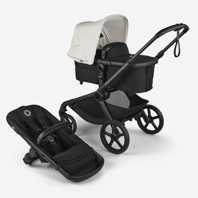 Bugaboo Kangaroo 2-in-1 stroller with one bassinet, Midnight Black fabrics, and Misty White sun canopy. A detached seat in Midnight Black sits next to the stroller. - Main Image Slide 1 of 18