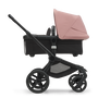 Side view of the Bugaboo Fox 5 carrycot pushchair with black chassis, midnight black fabrics and moring pink sun canopy. - Thumbnail Slide 3 of 16