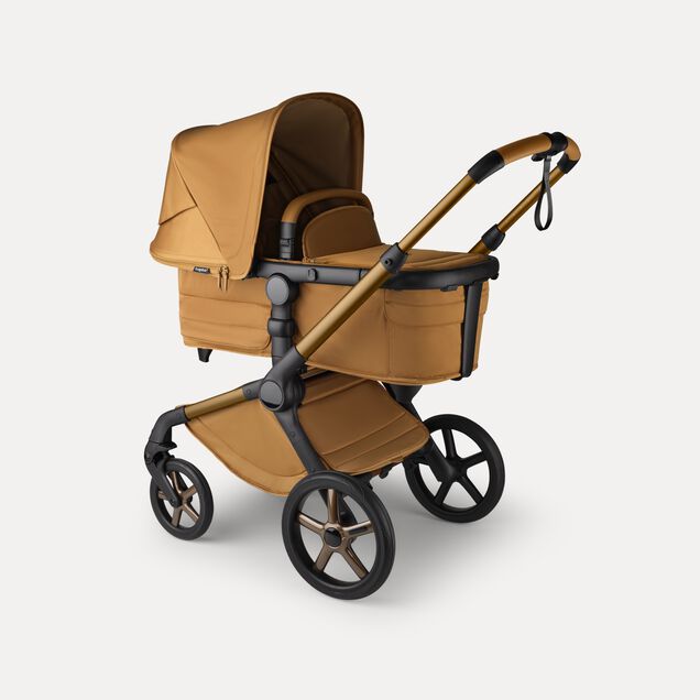 A Bugaboo Fox 5 Noir Limited Edition bassinet stroller in Amber Glow colorway. - Main Image Slide 3 of 15