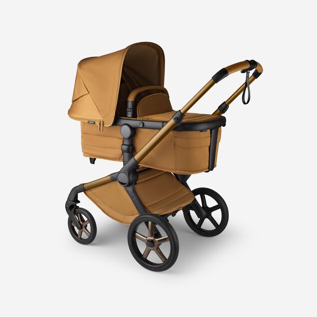 A Bugaboo Fox 5 Noir Limited Edition bassinet stroller in Amber Glow colorway. - Main Image Slide 3 of 15