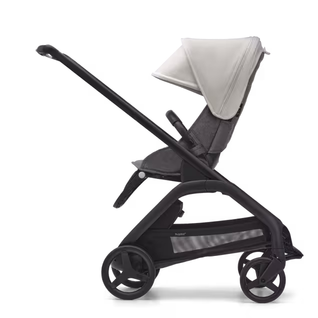 Side view of the Bugaboo Dragonfly seat stroller with black chassis, grey melange fabrics and misty white sun canopy. - Main Image Slide 2 of 16
