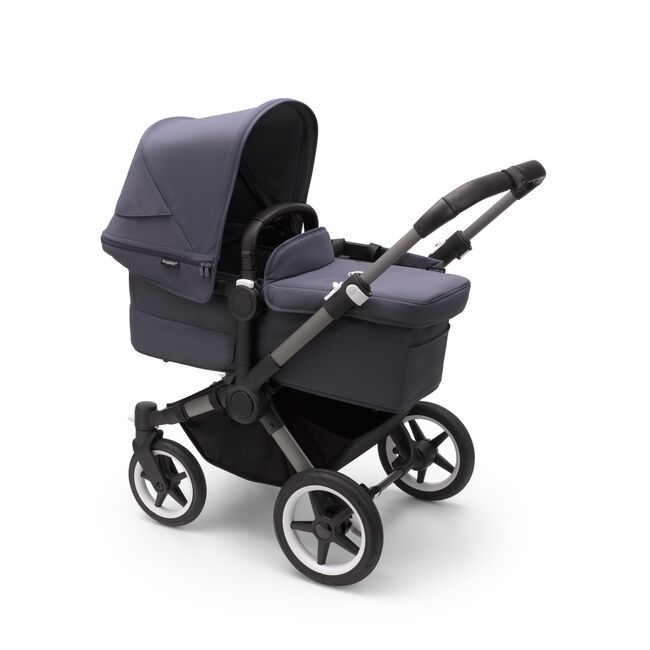 Bugaboo Donkey 5 Mono bassinet stroller with graphite chassis, stormy blue fabrics and stormy blue sun canopy.