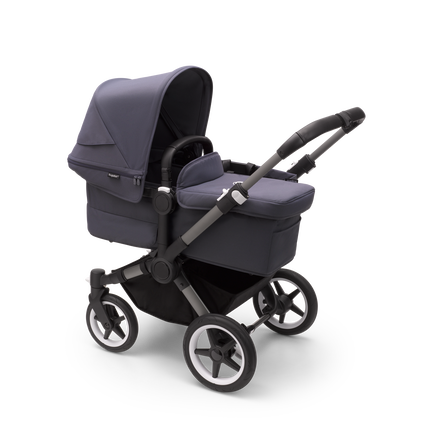 Bugaboo Donkey 5 Mono bassinet stroller with graphite chassis, stormy blue fabrics and stormy blue sun canopy.