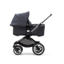 Side view of a Fox 3 bassinet stroller with graphite frame, stormy blue fabrics, and stormy blue sun canopy.