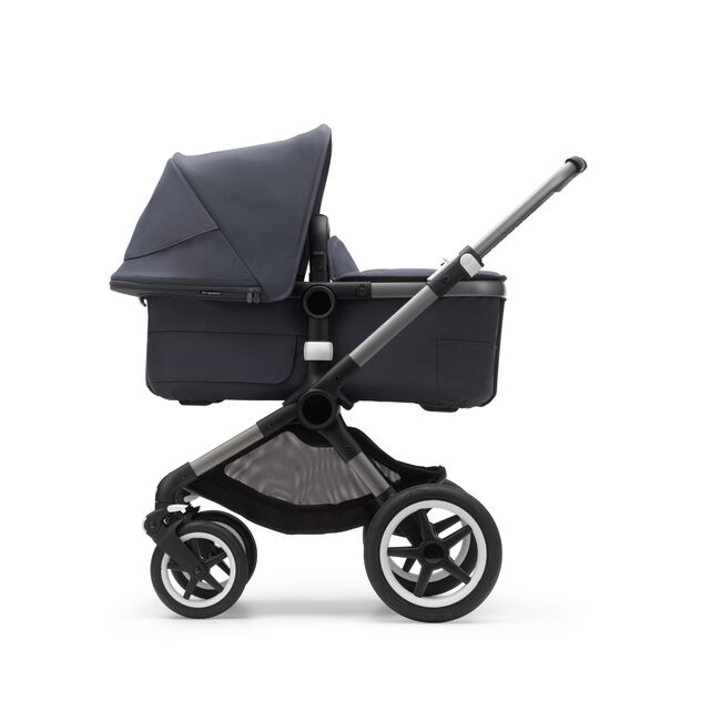 Side view of a Fox 3 carrycot pushchair with graphite frame, stormy blue fabrics, and stormy blue sun canopy. - Main Image Slide 9 of 9